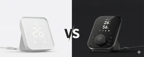 Side-by-side comparison of the white SwitchBot Hub 2 and the black SwitchBot Hub 3, each showing temperature and humidity on its display